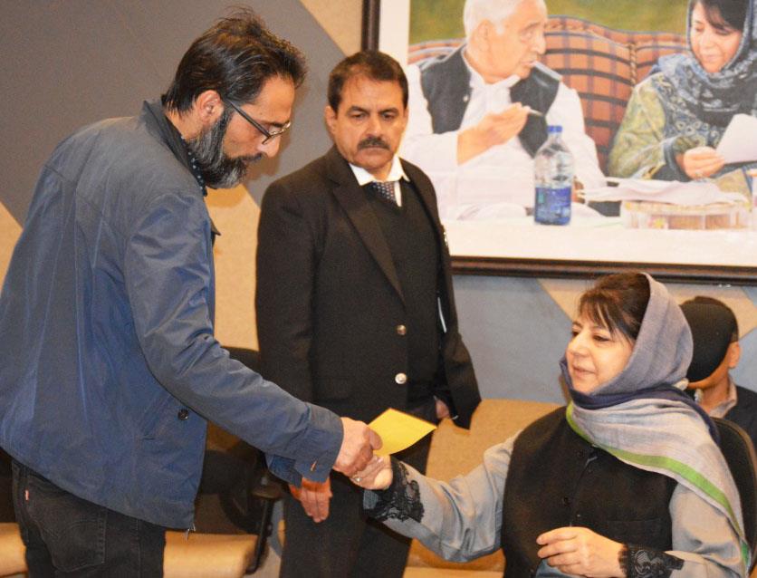 Mehbooba distributes appointment orders among visually impaired pellet victims