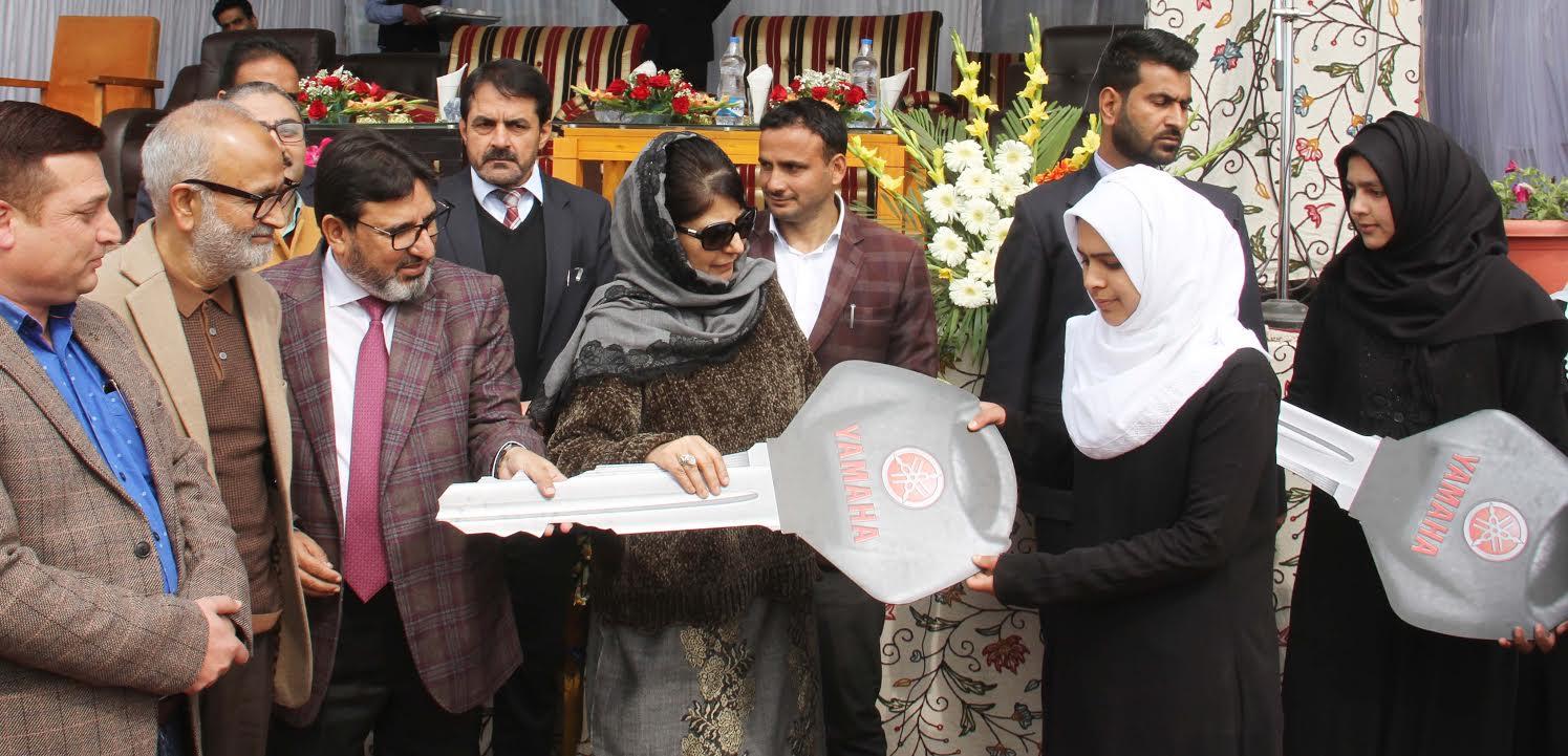 Mehbooba distributes scooties among 50 meritorious girl students at Ganderbal