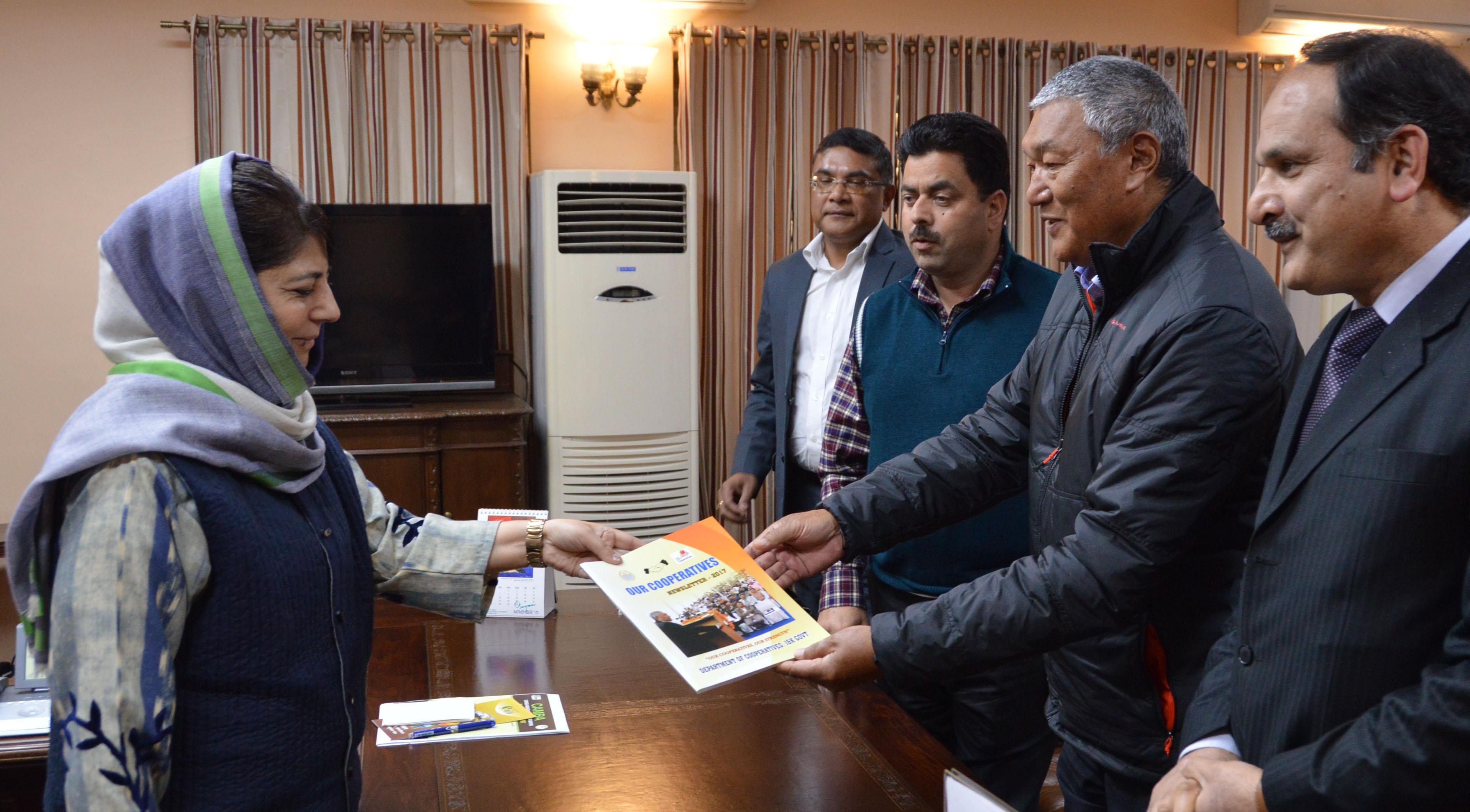 Dorjey presents copy of ‘Our Cooperatives’ to CM
