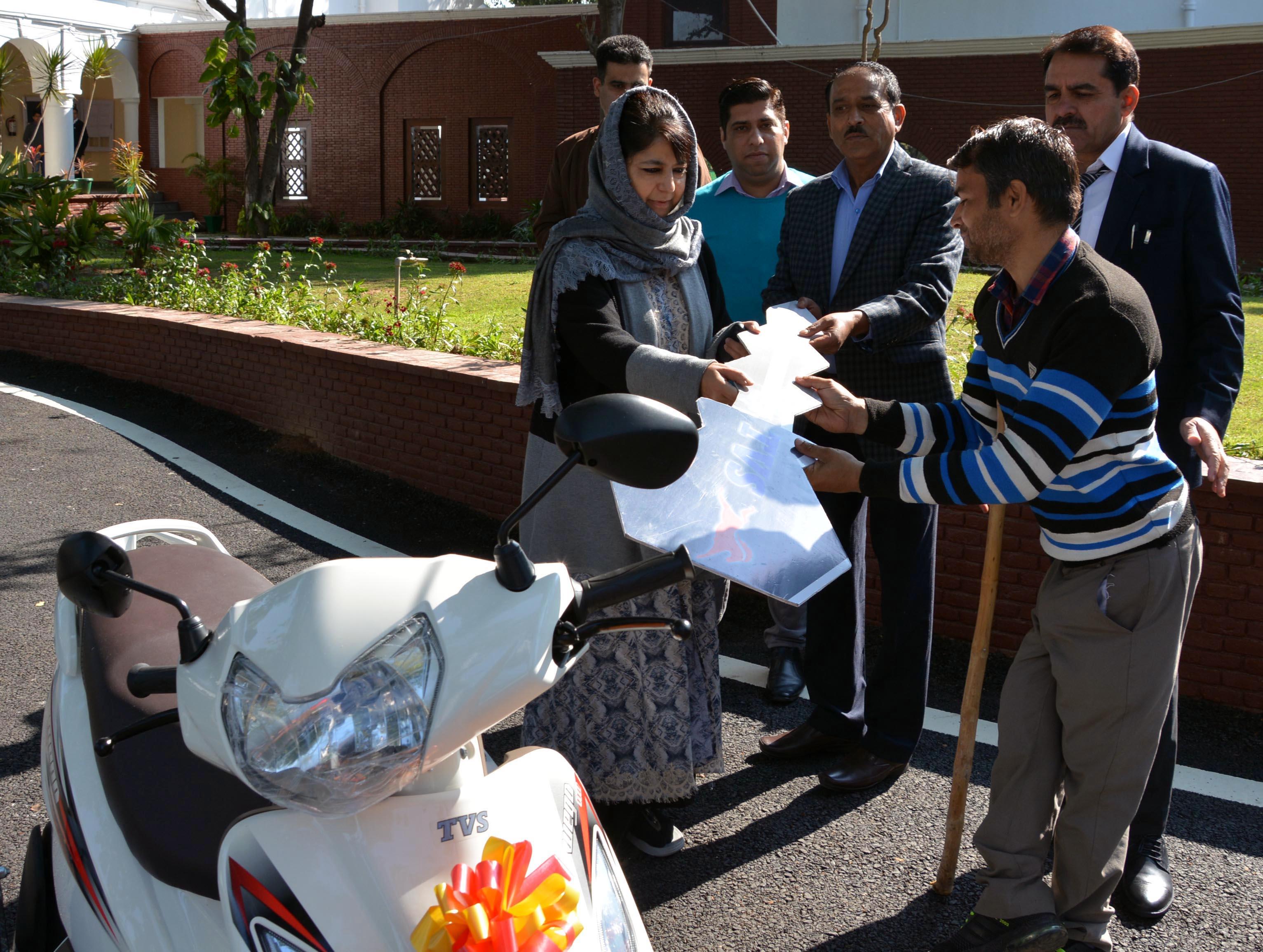 CM hands over motorised bicycle to handicapped