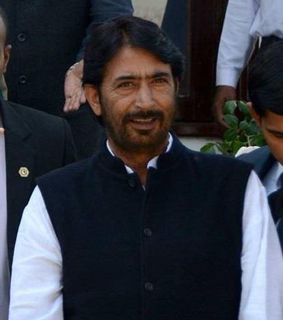 G A Mir greets people on Holi