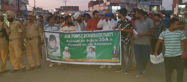 PDP takes out candle light protest against tinkering with Article 35-A in Kathua