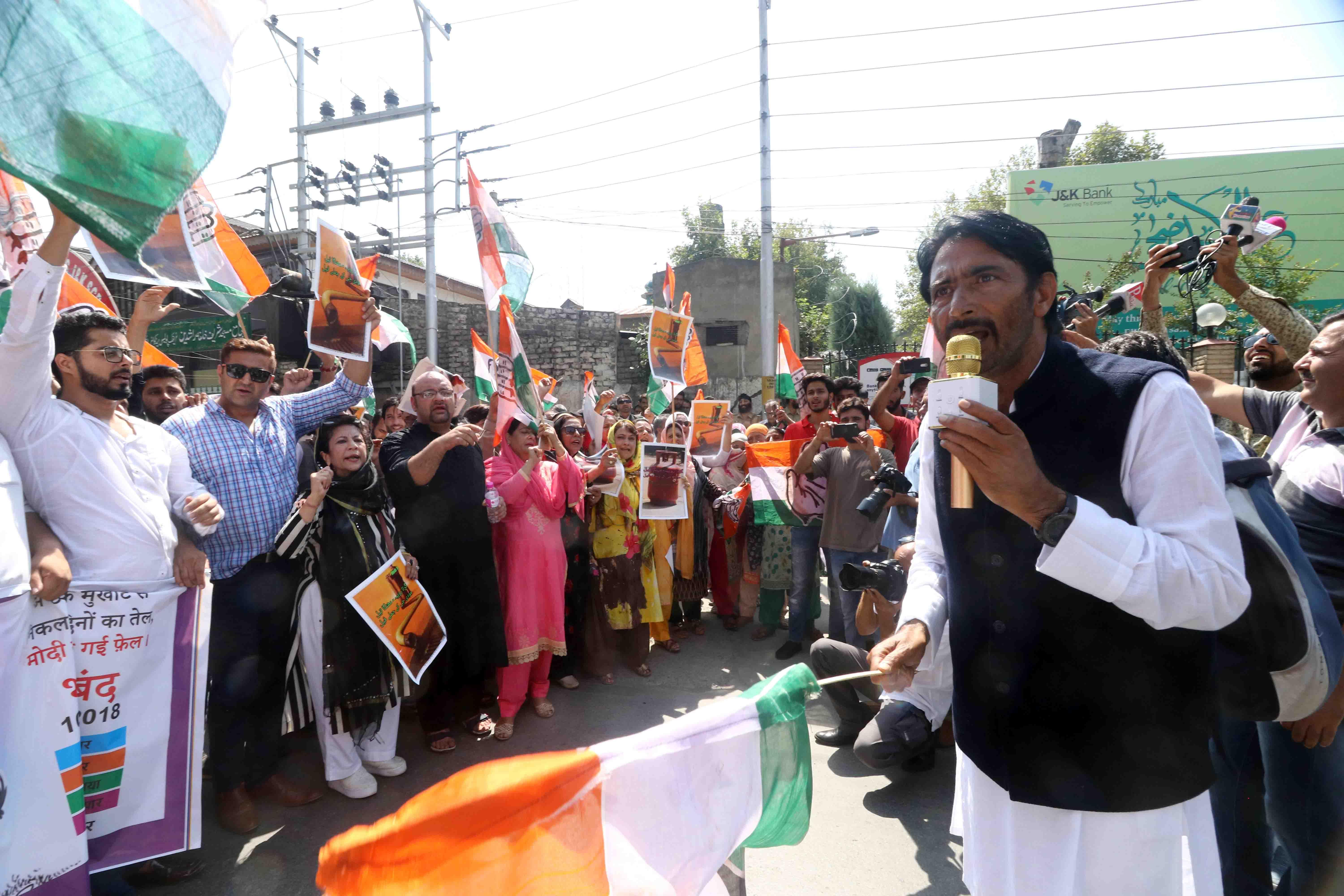 G A Mir leads protest against rising prices on petroleum, gas products