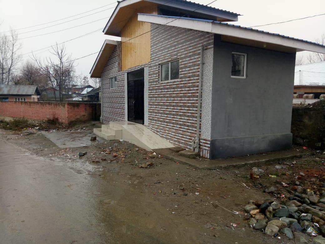 Toilet complex built in violation comes under road widening at Watergam Rafiabad