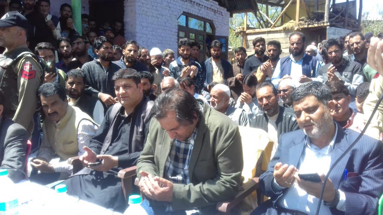 Sajad Lone visits slain PC workers family, promises to bear monthly expenses of family, sympathizes bereaved family