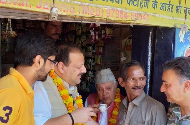 Farooq sips tea at a stall in congested old Jammu city market; interacts with people, tourists