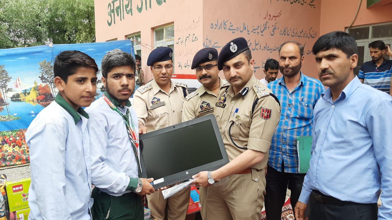 Handwara police distributes computres, stationery items