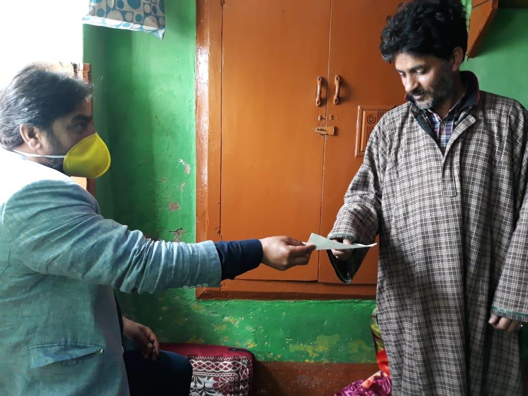PDP leader handover relief cheque to Gulshanabad family