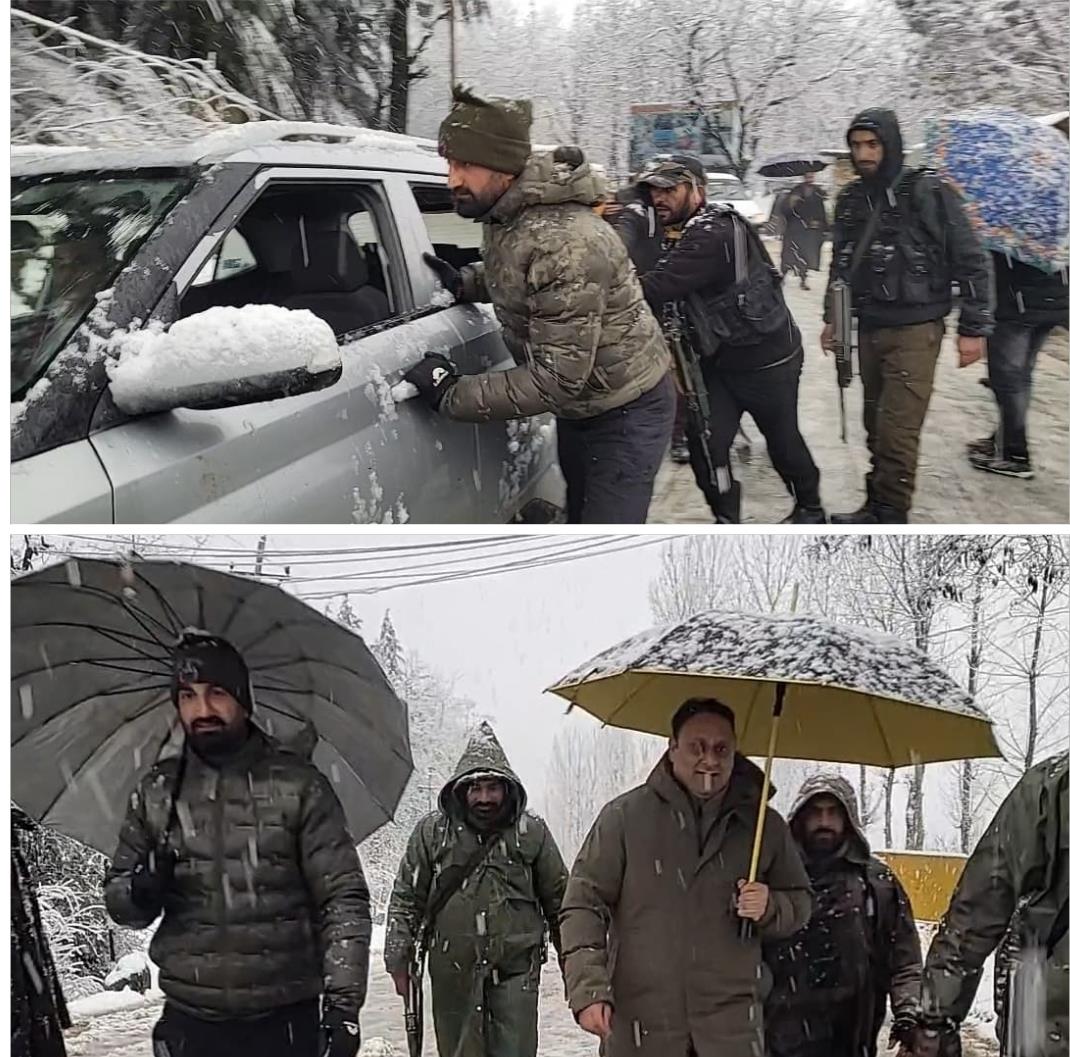Police provides assistance amid snowfall and slippery road conditions in Handwara